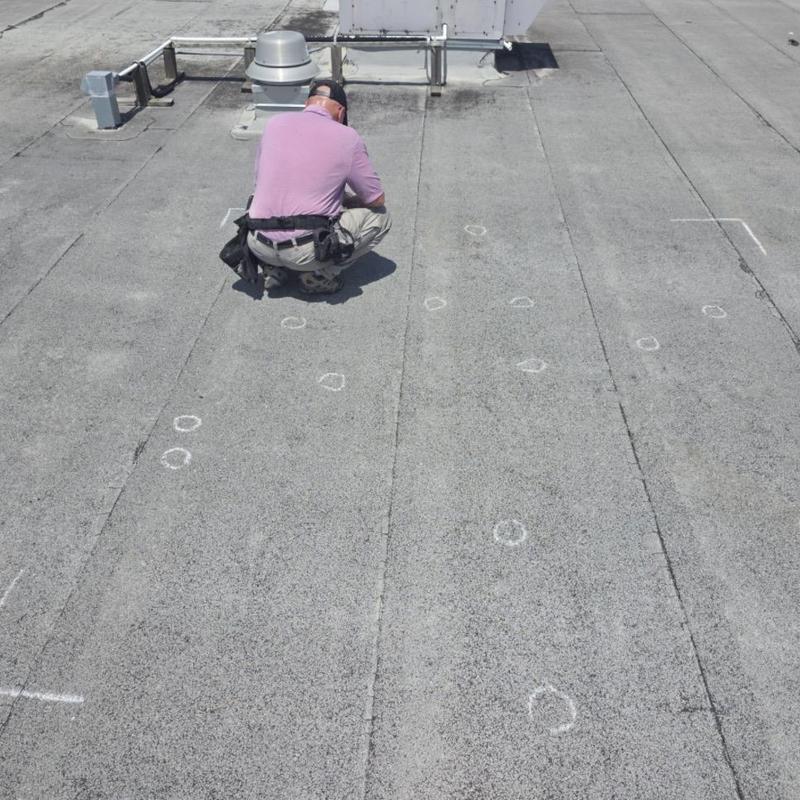 Modified bitumen roof with hail damage markings
