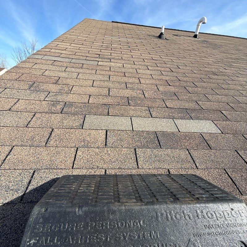 Asphalt shingles with hail damage on roof