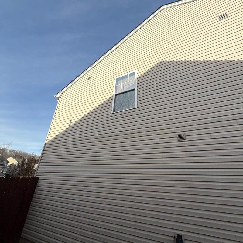 Vinyl siding exterior wall with window and vent