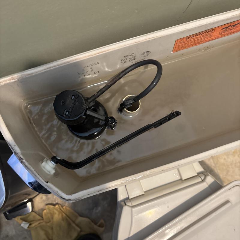 Toilet tank interior with water and float valve mechanism