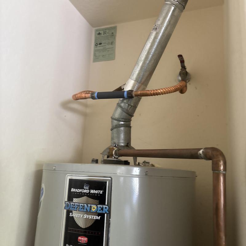 50-gallon gas water heater with vent and copper piping