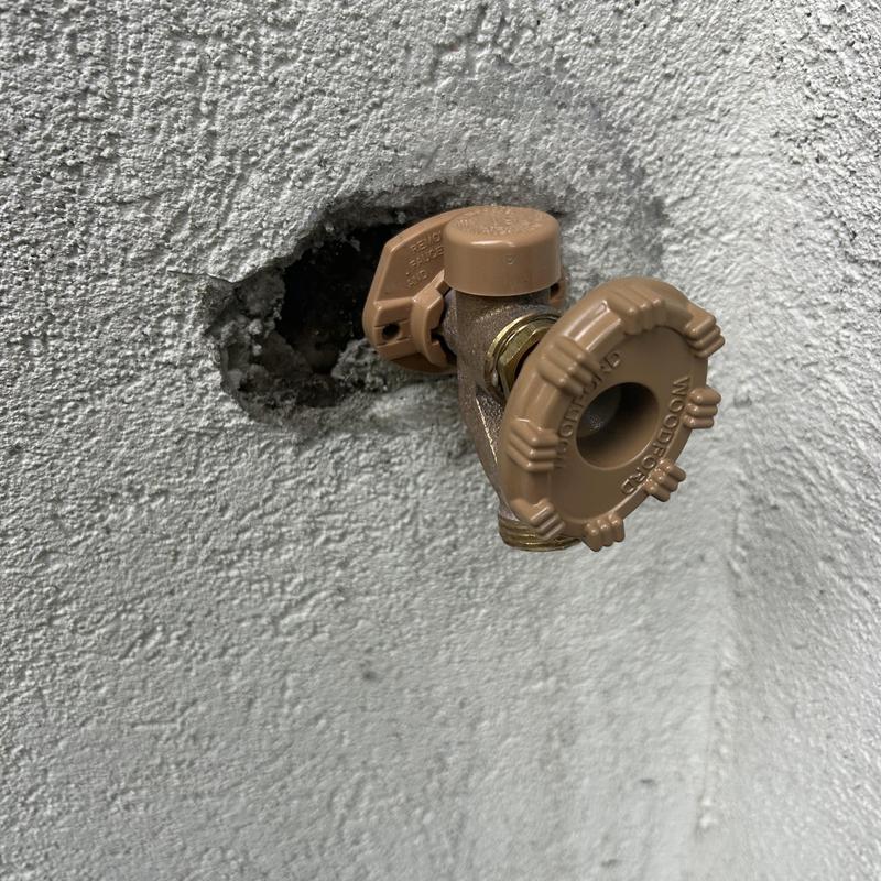 Hose bib installation on exterior stucco wall