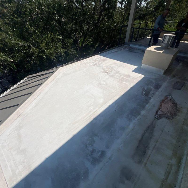 Flat deck roofing surface with inspection damage area Flat deck roofing surface with inspection damage area