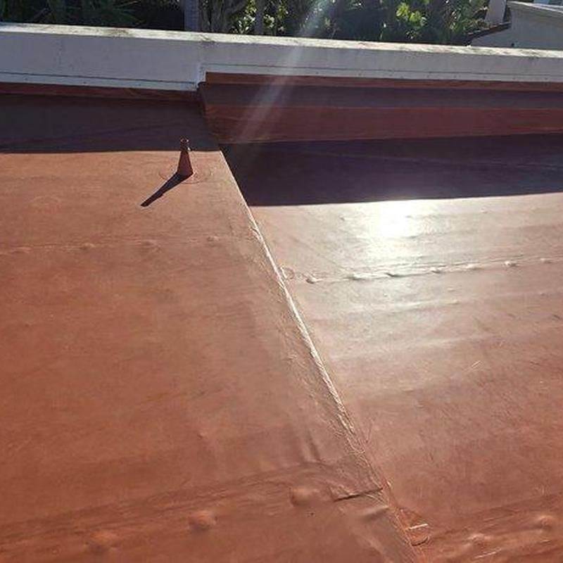Flat roofing membrane with repaired seams and vent pipe Flat roofing membrane with repaired seams and vent pipe