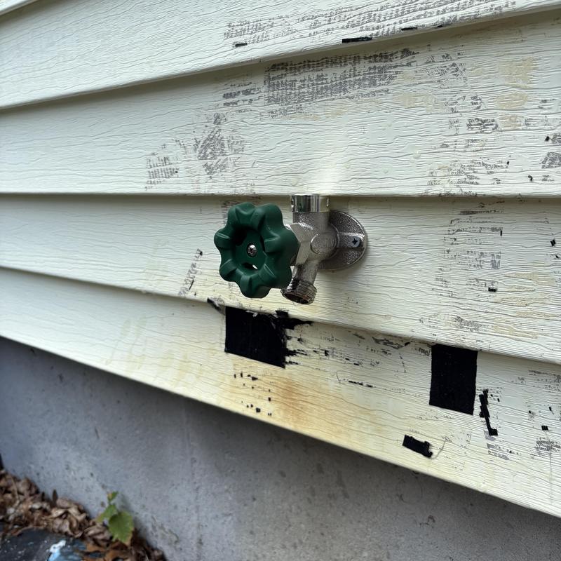 Frost-free outside faucet installed on house siding Frost-free outside faucet installed on house siding