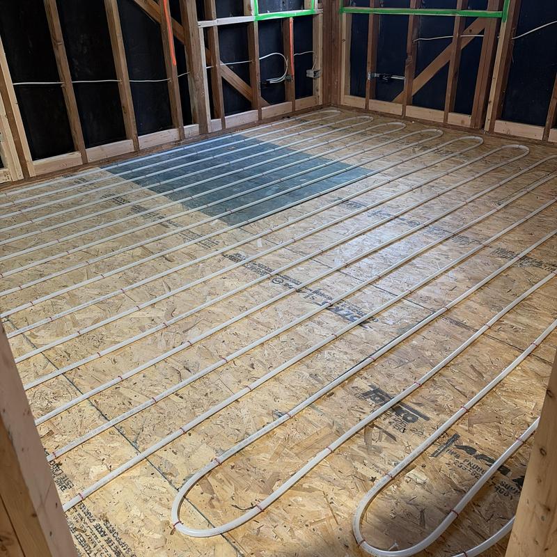 Radiant heating tubing installation on subfloor