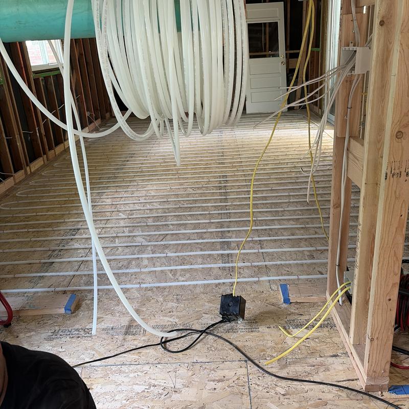 Radiant heating tubing layout in floor installation