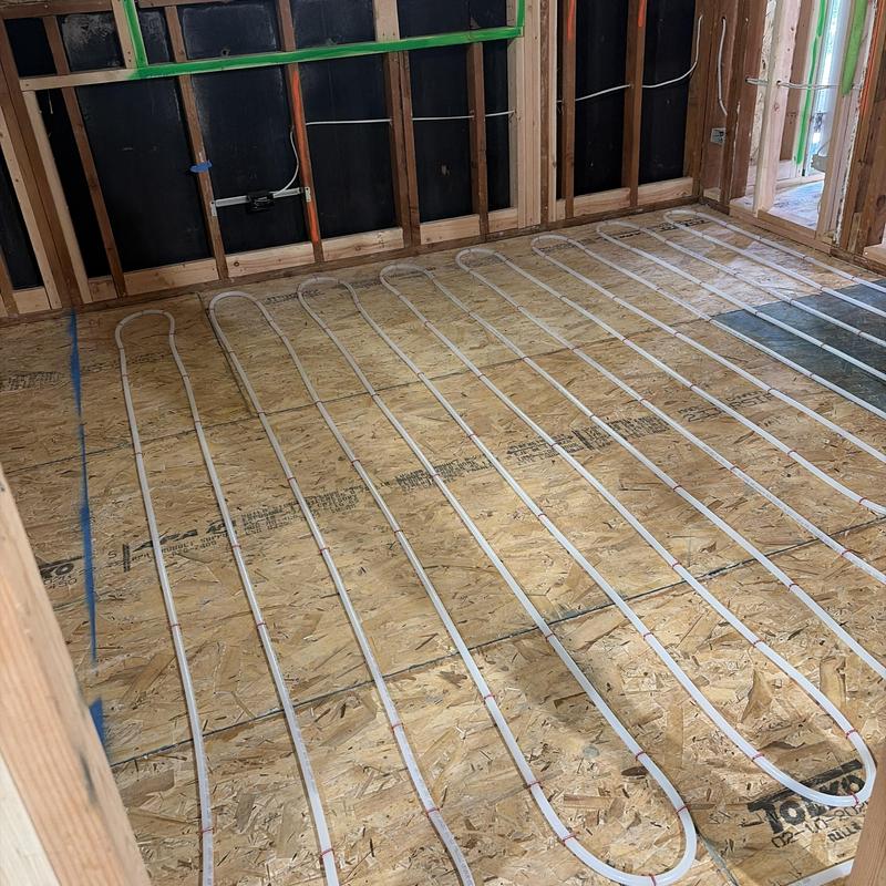 Radiant heating tubing layout on plywood subfloor