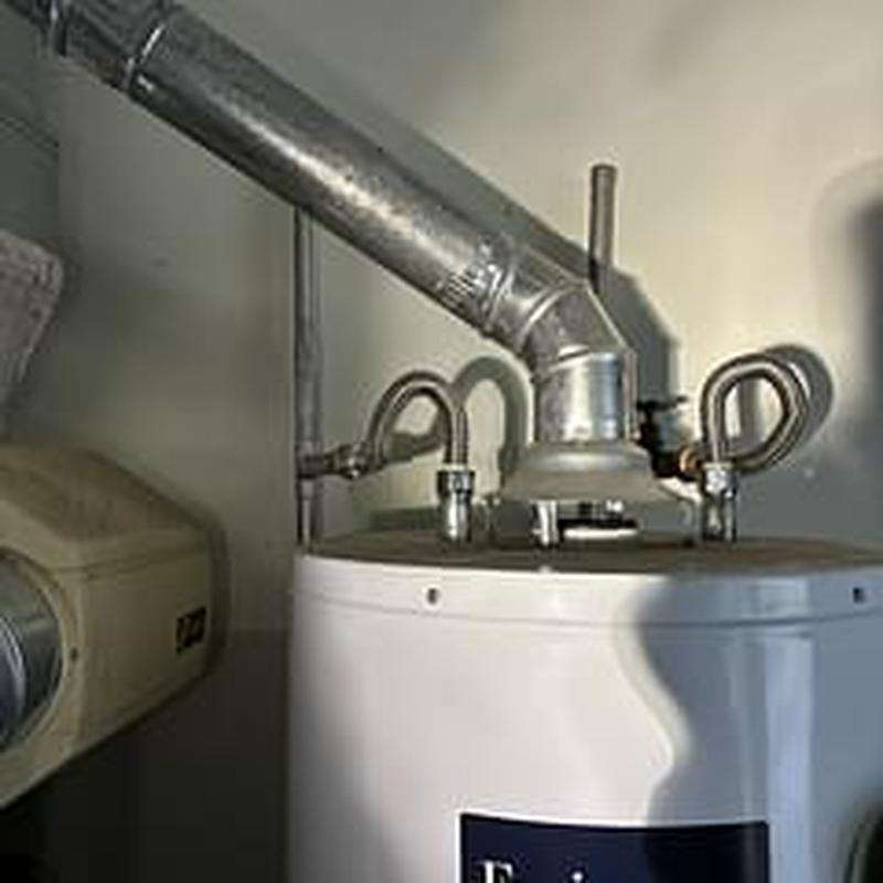 Water heater vent pipe and supply connections installation