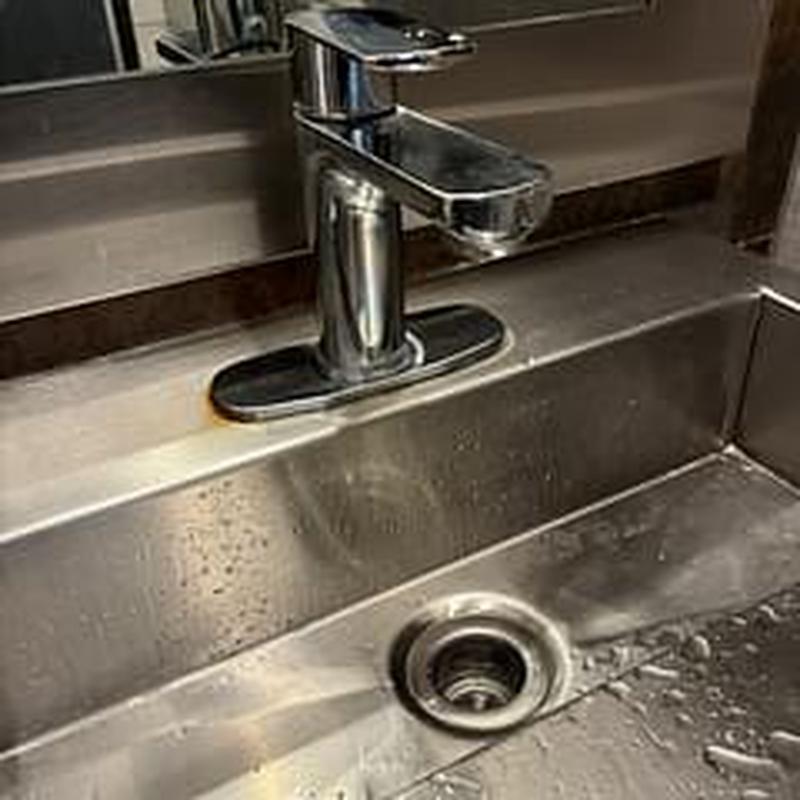 Single handle lavatory faucet on stainless steel sink Single handle lavatory faucet on stainless steel sink