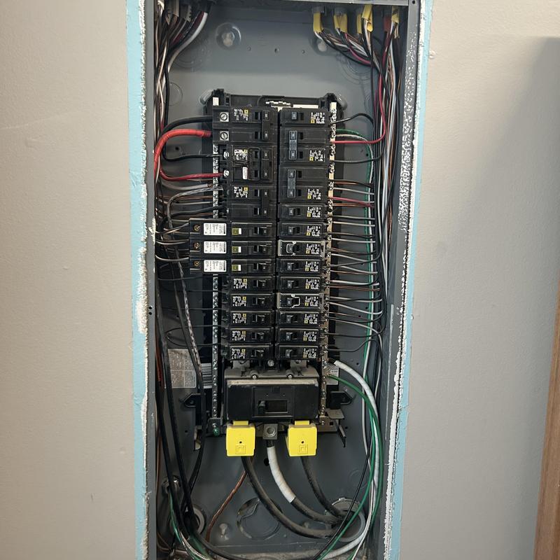Whole home surge protector in electrical panel installation Whole home surge protector in electrical panel installation