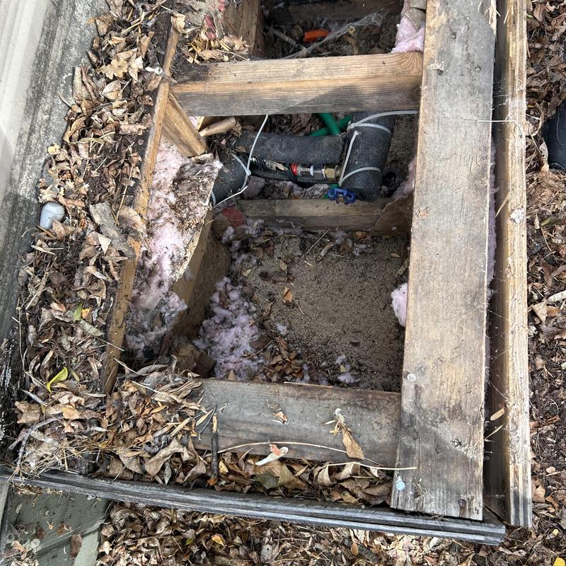 Waterline installation pit with exposed piping and insulation Waterline installation pit with exposed piping and insulation
