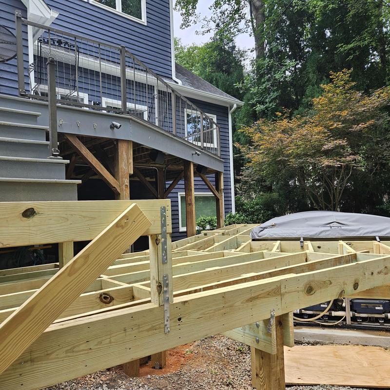 Deck framing construction near home and covered pool Deck framing construction near home and covered pool