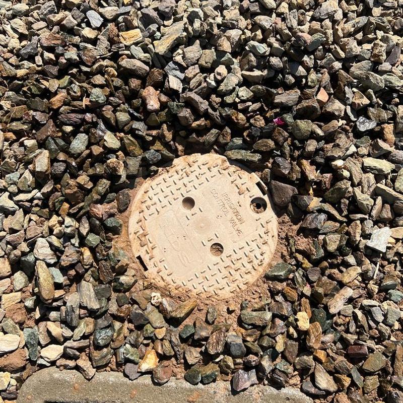 Pressure reducing valve cover box set in gravel