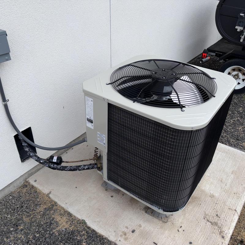 3.5-ton Payne heat pump on concrete pad outside 3.5-ton Payne heat pump on concrete pad outside