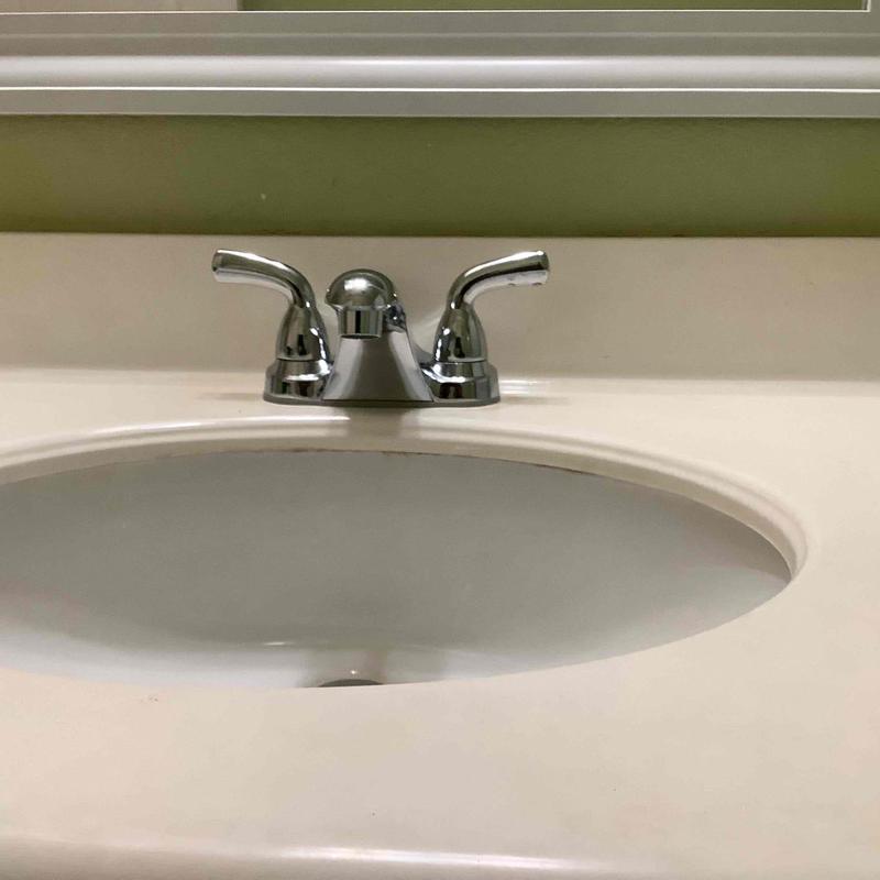 Bathroom sink faucet with new angle stop installed