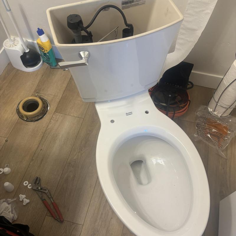 Toilet bowl and tank installation with plumbing tools