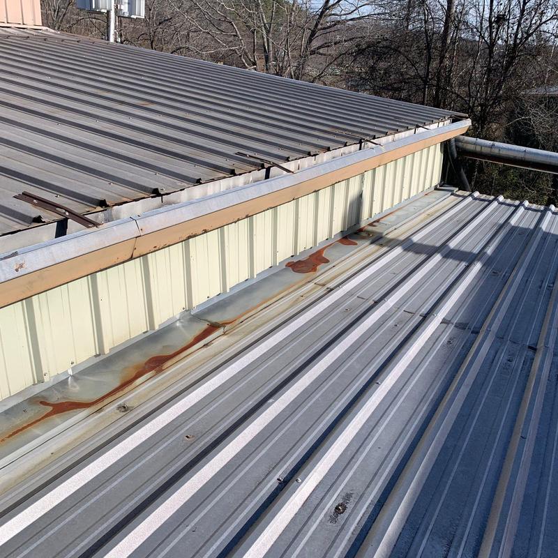 Metal roof panels with rust and hail damage inspection