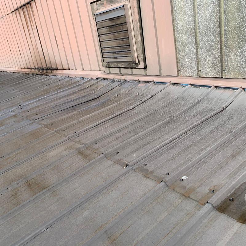 Metal commercial roofing panels with hail damage inspection