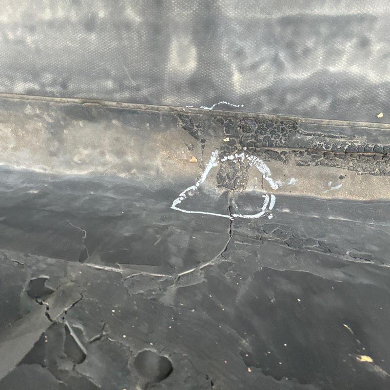 Rubber roof membrane crack with marked damage
