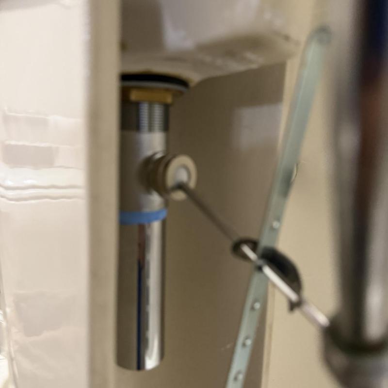 Chrome pop-up assembly for bathroom sink installed