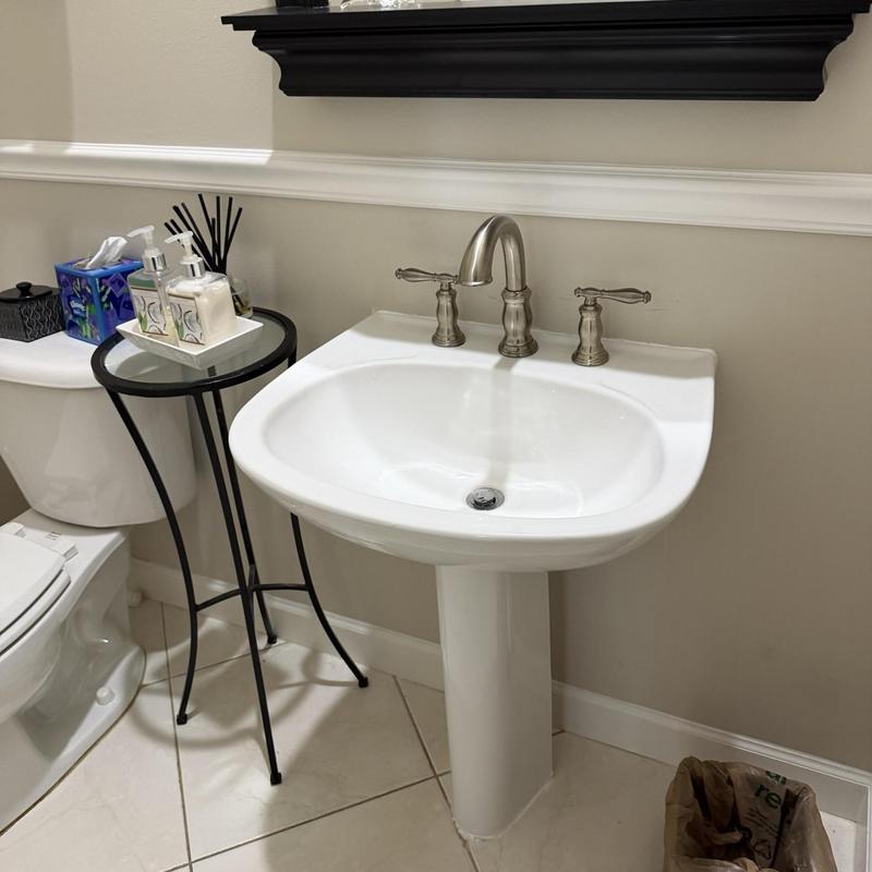 Pedestal sink with chrome pop-up drain assembly
