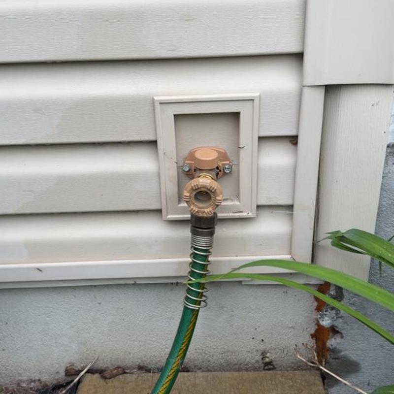Frost-free outdoor spigot with garden hose attached