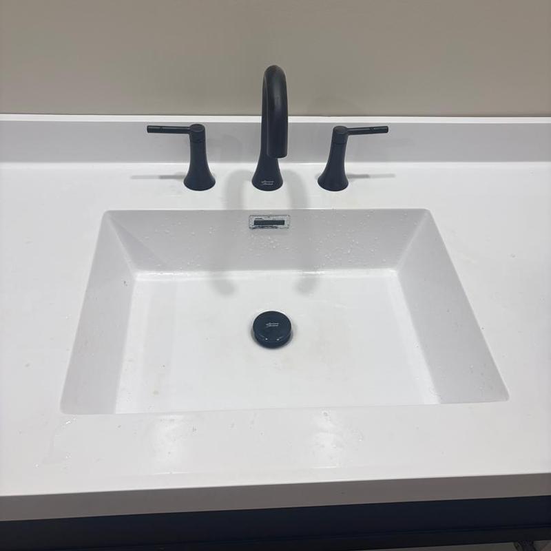 Bathroom sink with black faucet and handles installation
