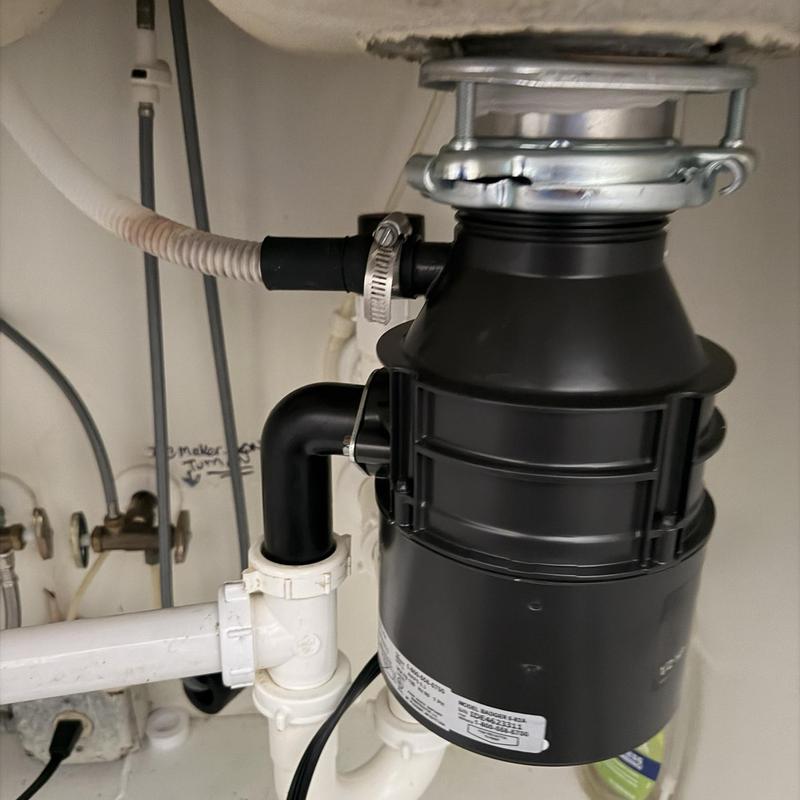 Garbage disposal installation under kitchen sink
