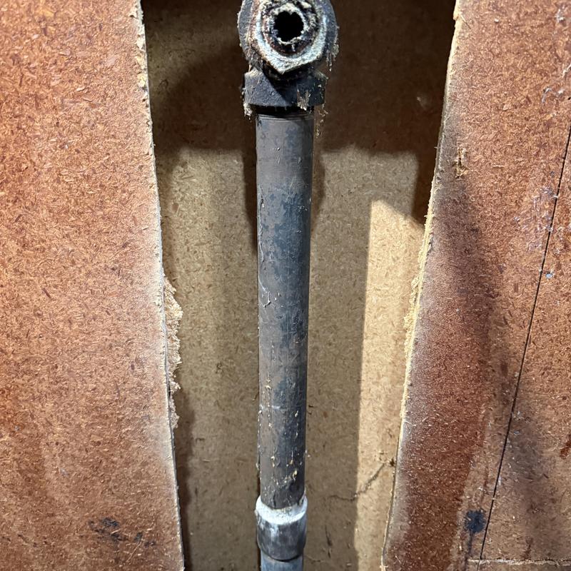 Laundry drain pipe with corroded metal valve connection