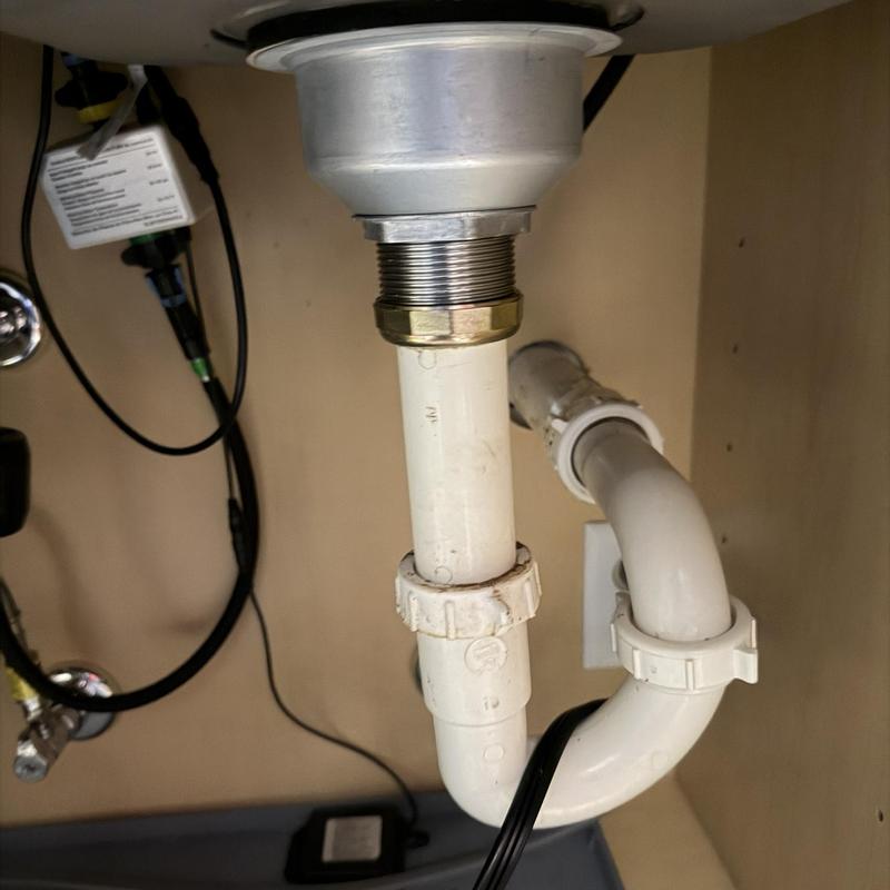 Basket strainer and PVC drain pipe under sink