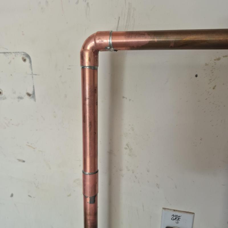 1-inch copper water line corner with soldered joints