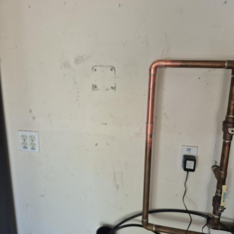 Copper water line with electrical outlet nearby