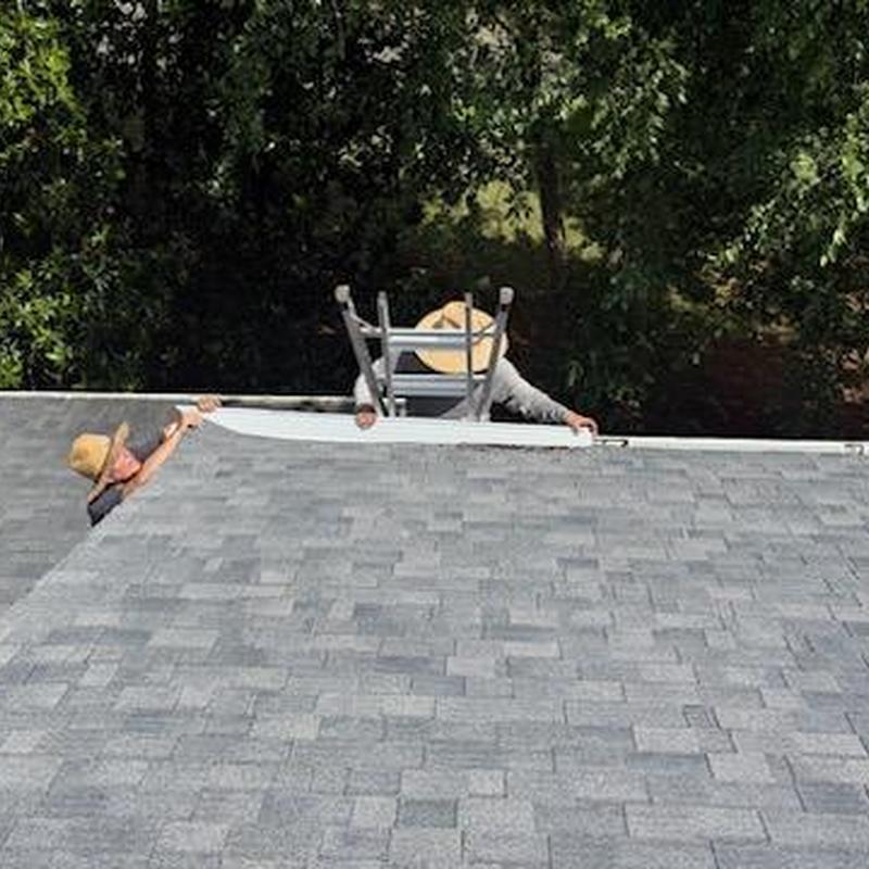 Gutter guards installation on asphalt shingle roof