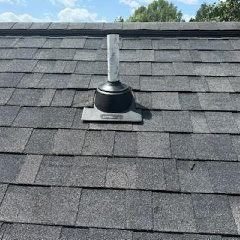 Roof vent flashing on asphalt shingle roof