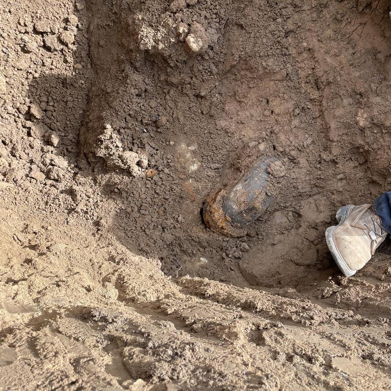 City sewer mainline exposed in dirt excavation City sewer mainline exposed in dirt excavation