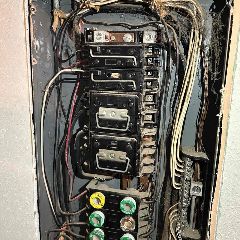Electrical breaker panel with wires and fuses Electrical breaker panel with wires and fuses