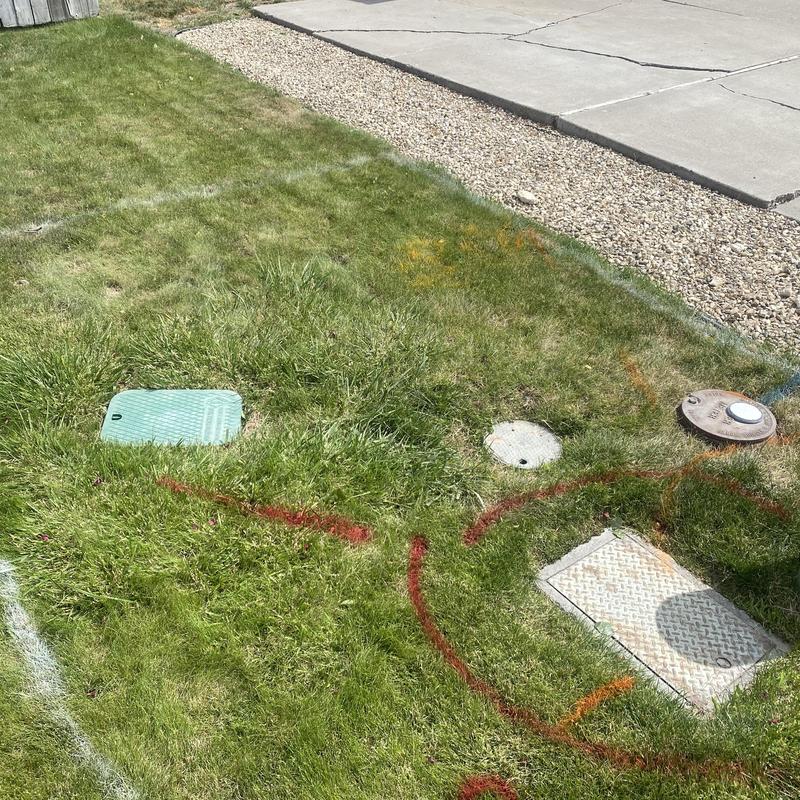 Water meter and irrigation backflow with ground markings Water meter and irrigation backflow with ground markings