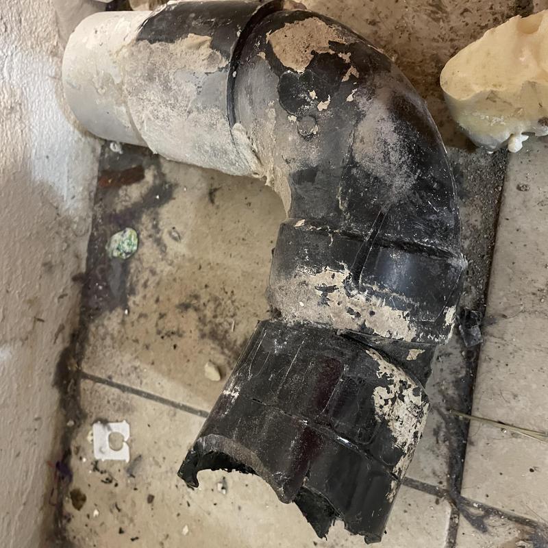 Toilet drain pipe flange with damaged flange section Toilet drain pipe flange with damaged flange section
