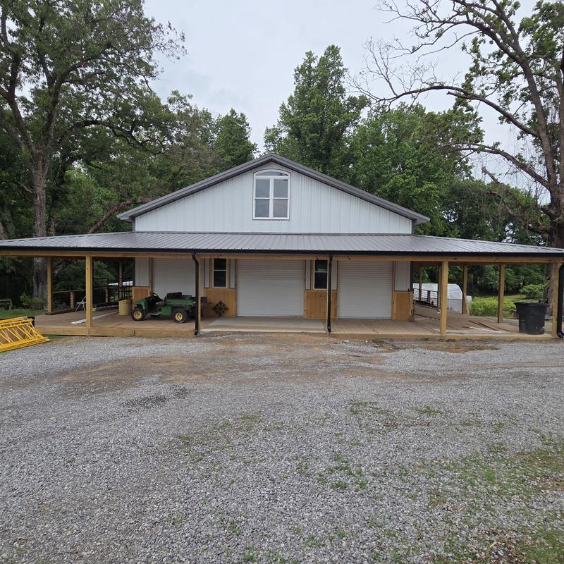 Metal roof on new build barn with covered porch
