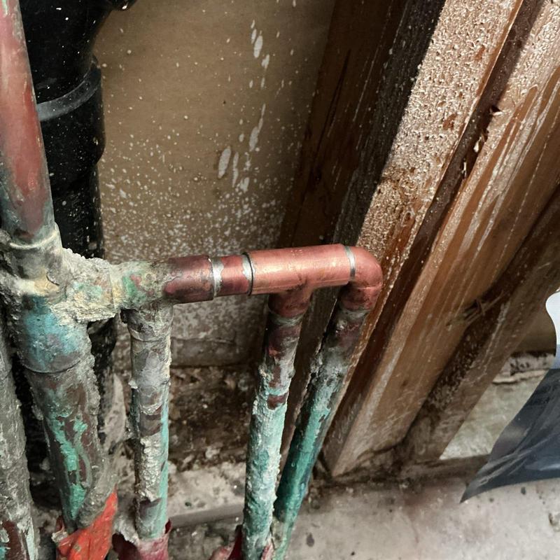 12-inch copper water manifold with corrosion buildup