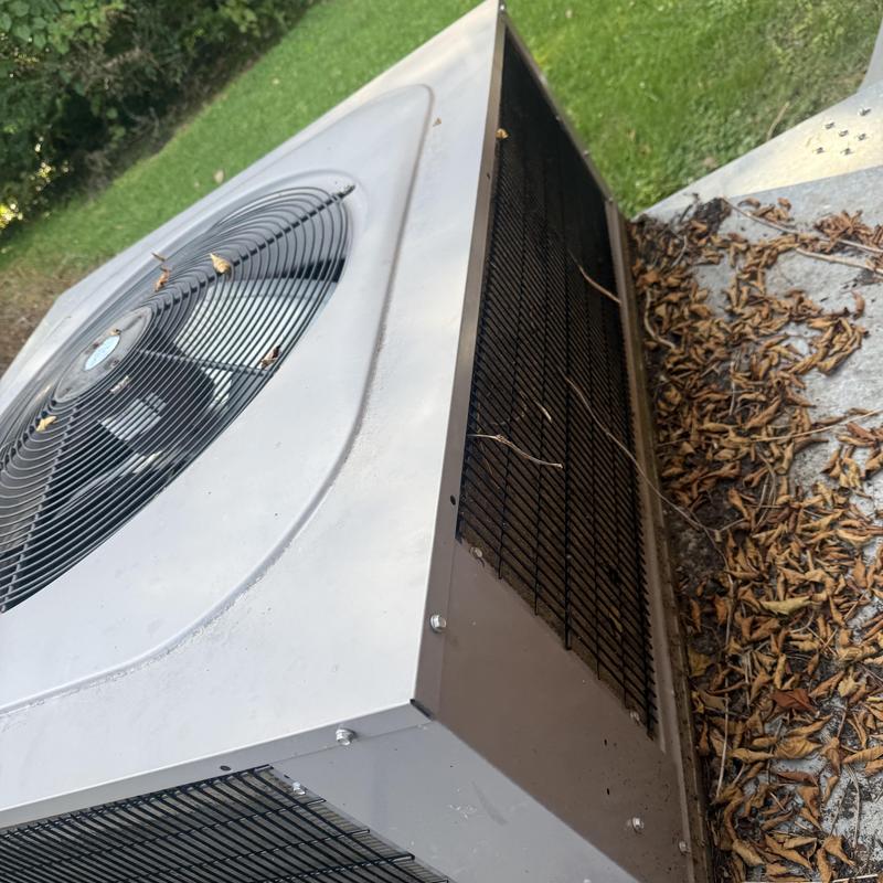 Air conditioner condenser coil with dirt and debris buildup Air conditioner condenser coil with dirt and debris buildup