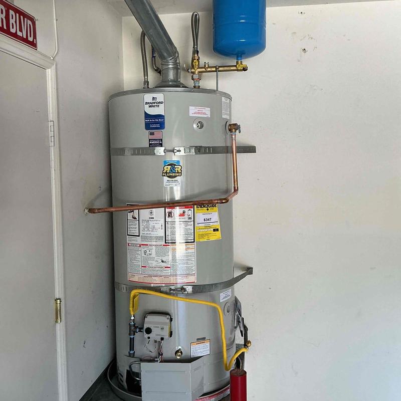 Gas water heater installation with new plumbing connections