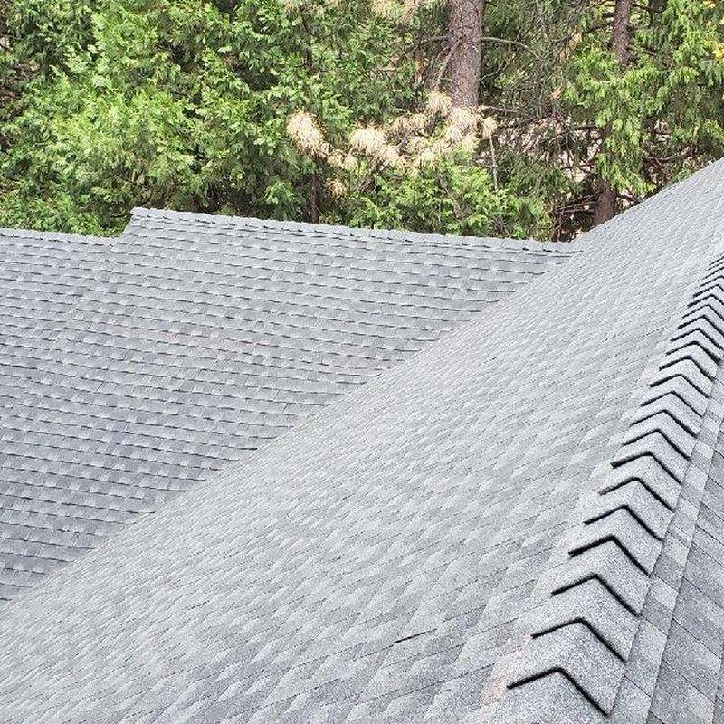Asphalt shingle roof with ridge vent on cabin in Twain Hart