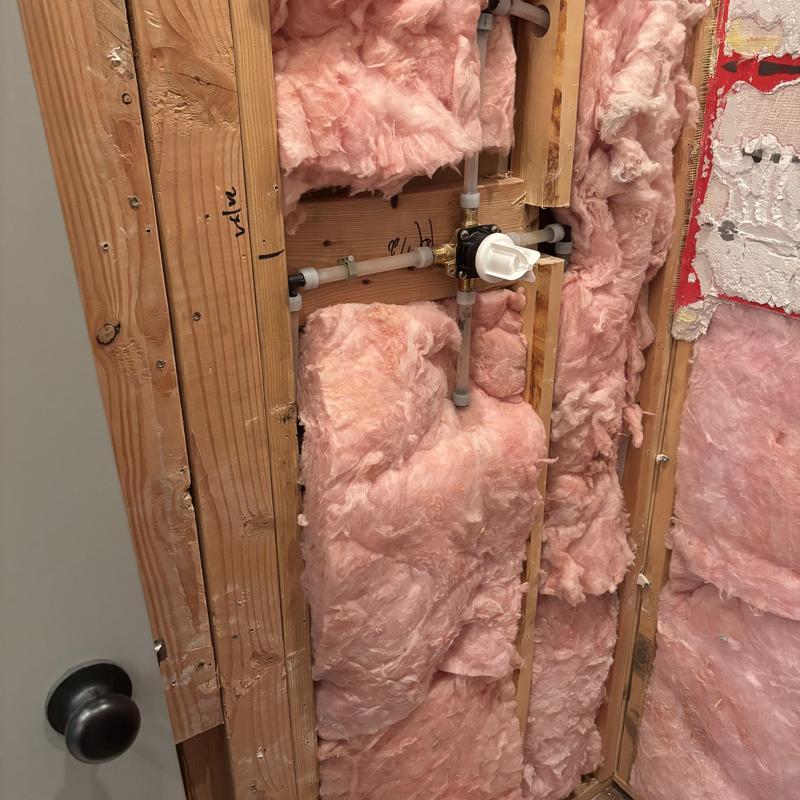Shower valve installation with plumbing and insulation Shower valve installation with plumbing and insulation