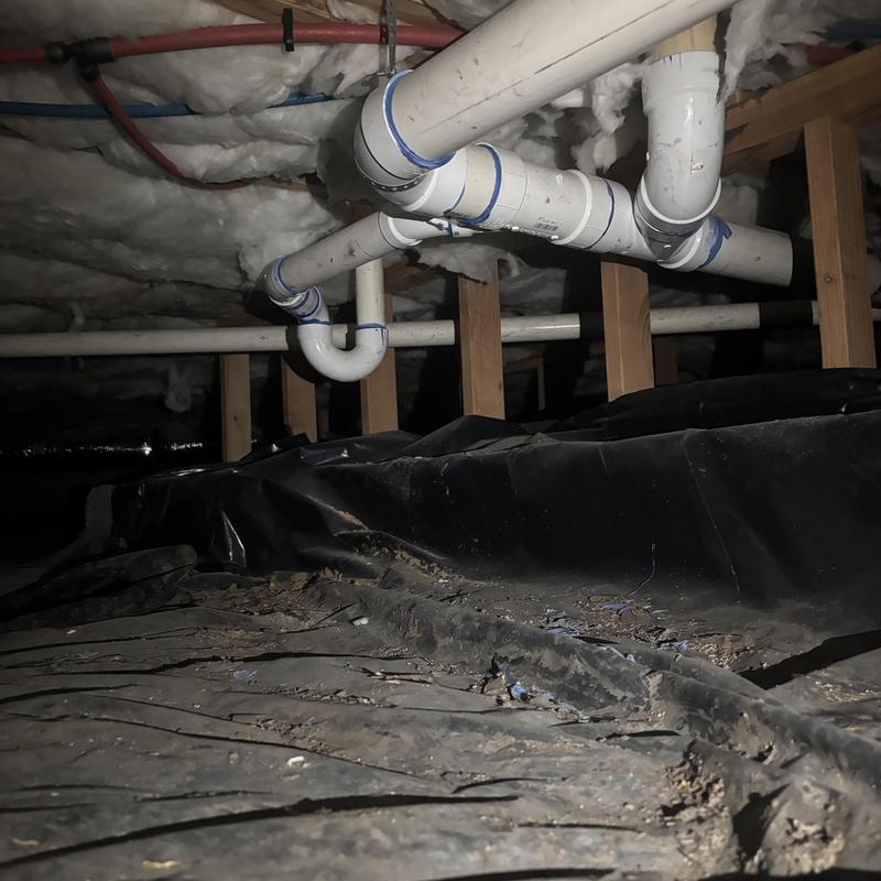 PVC drain pipes installed in basement crawl space PVC drain pipes installed in basement crawl space