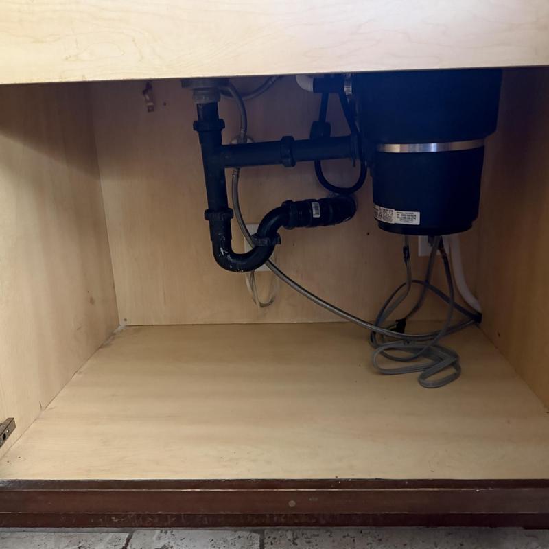 Dishwasher hookup and garbage disposal plumbing under sink