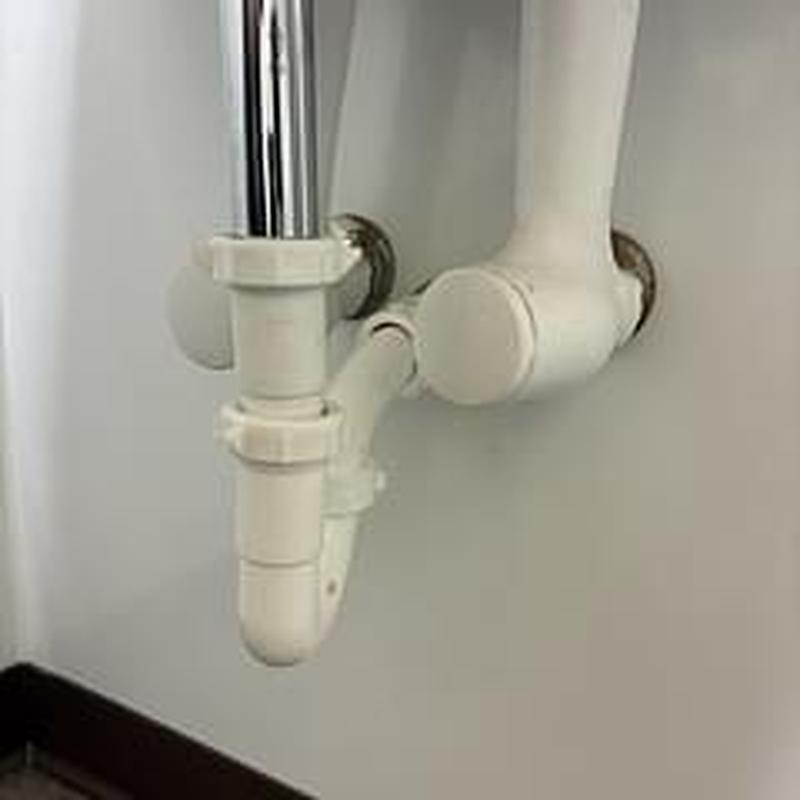 Sink drain trap and piping with new fittings installed