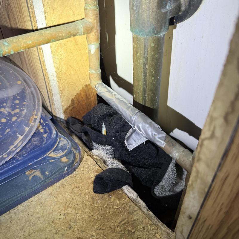 Copper water pipe with taped pinhole leak and emergency stop Copper water pipe with taped pinhole leak and emergency stop