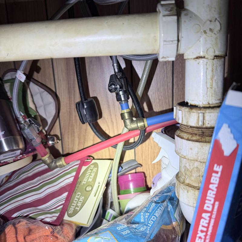 Faucet emergency stop valve and PEX piping under sink Faucet emergency stop valve and PEX piping under sink